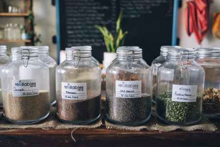 assorted seeds in glass jar containers