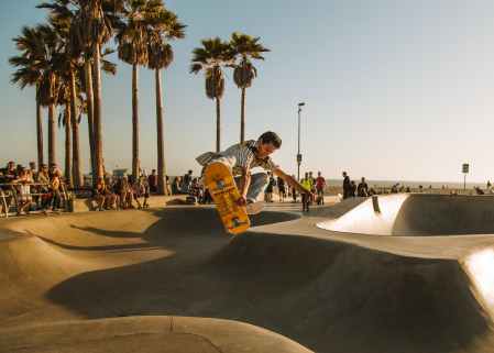 man performing on skate park