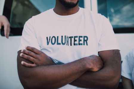 Man wearing volunteer t-shirt