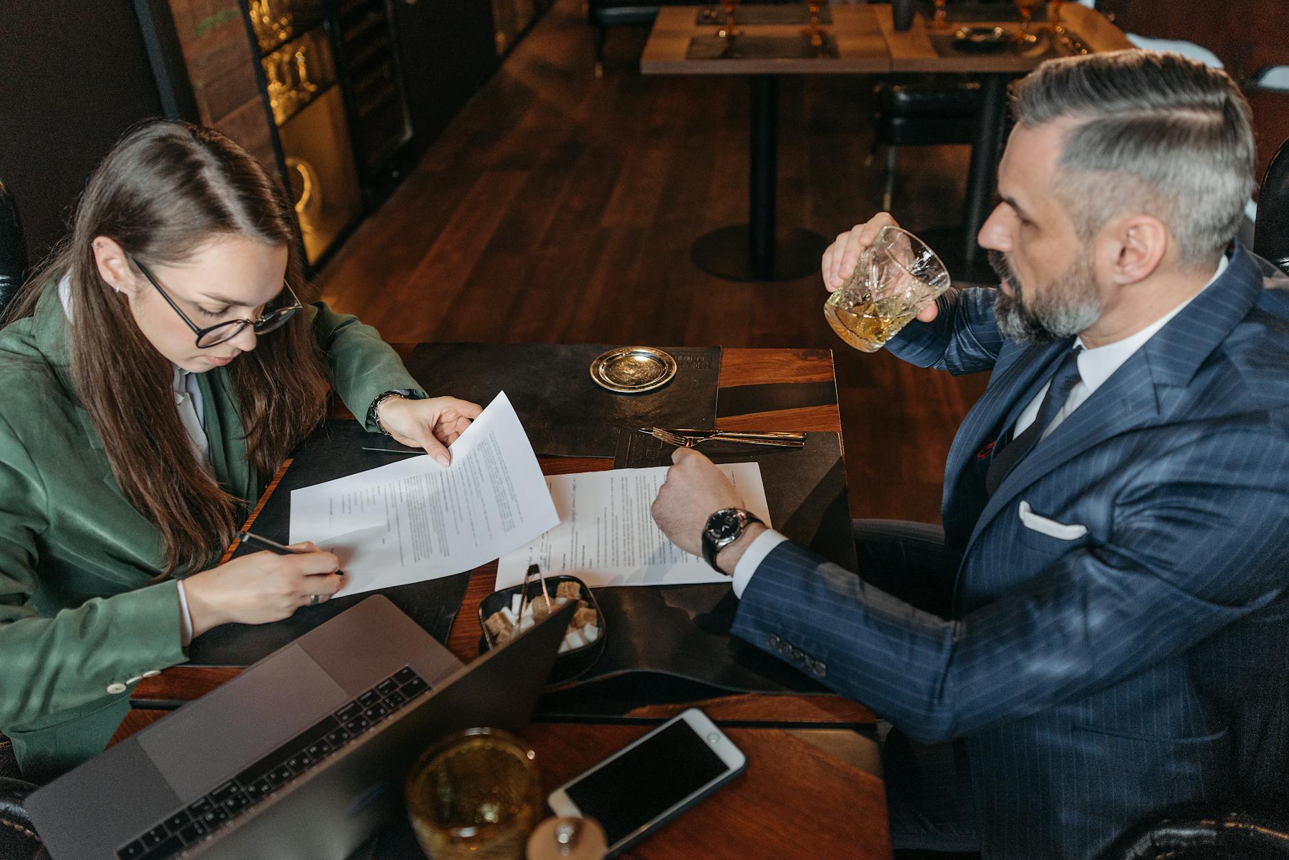 woman signing the paper