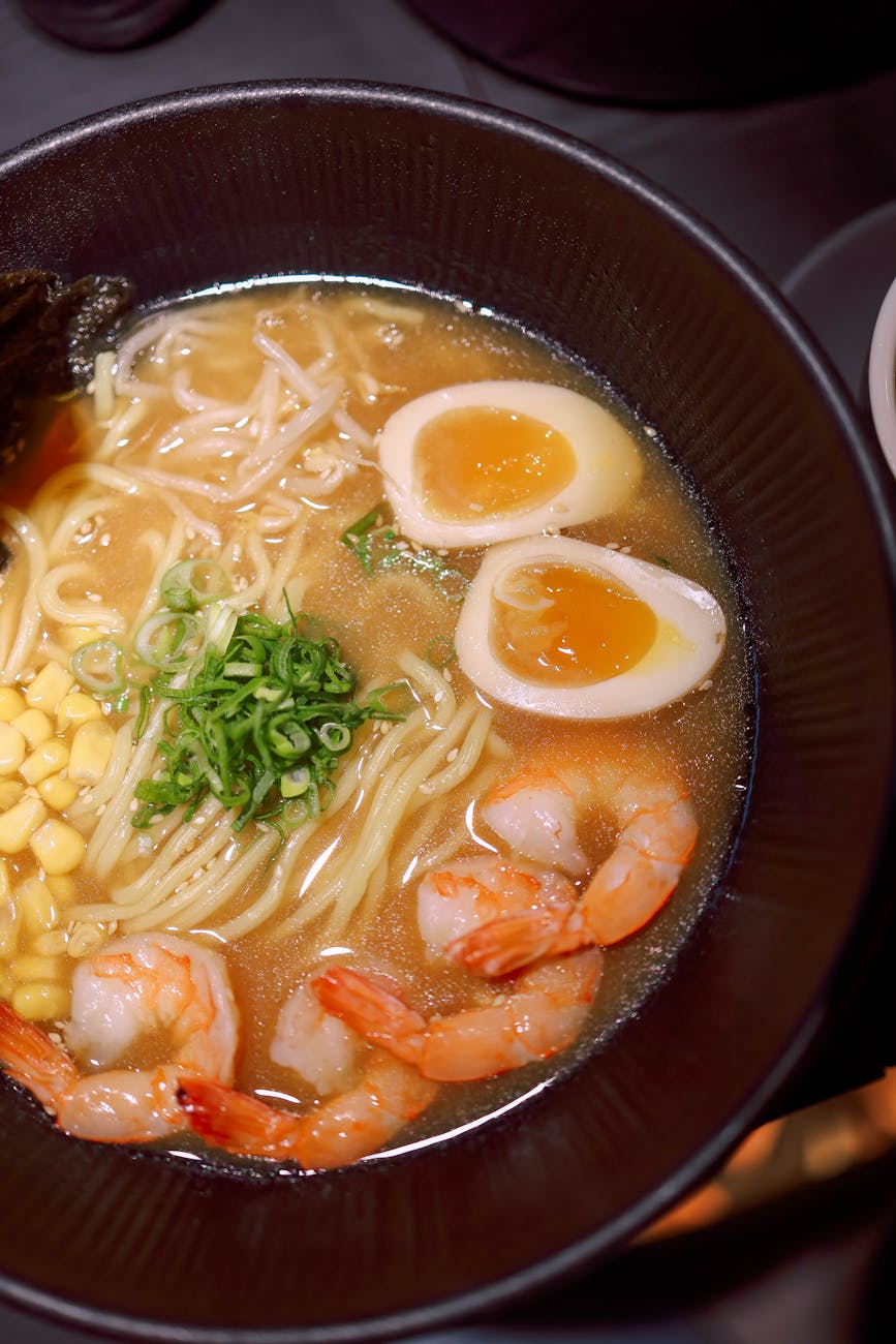 delicious shrimp ramen with egg and corn